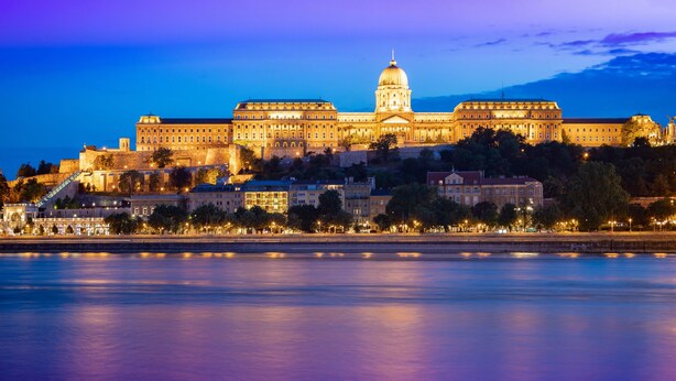 A large, historic building with a prominent dome, situated by a body of water. - Mercure Budapest City Center Hotel (Budapest)