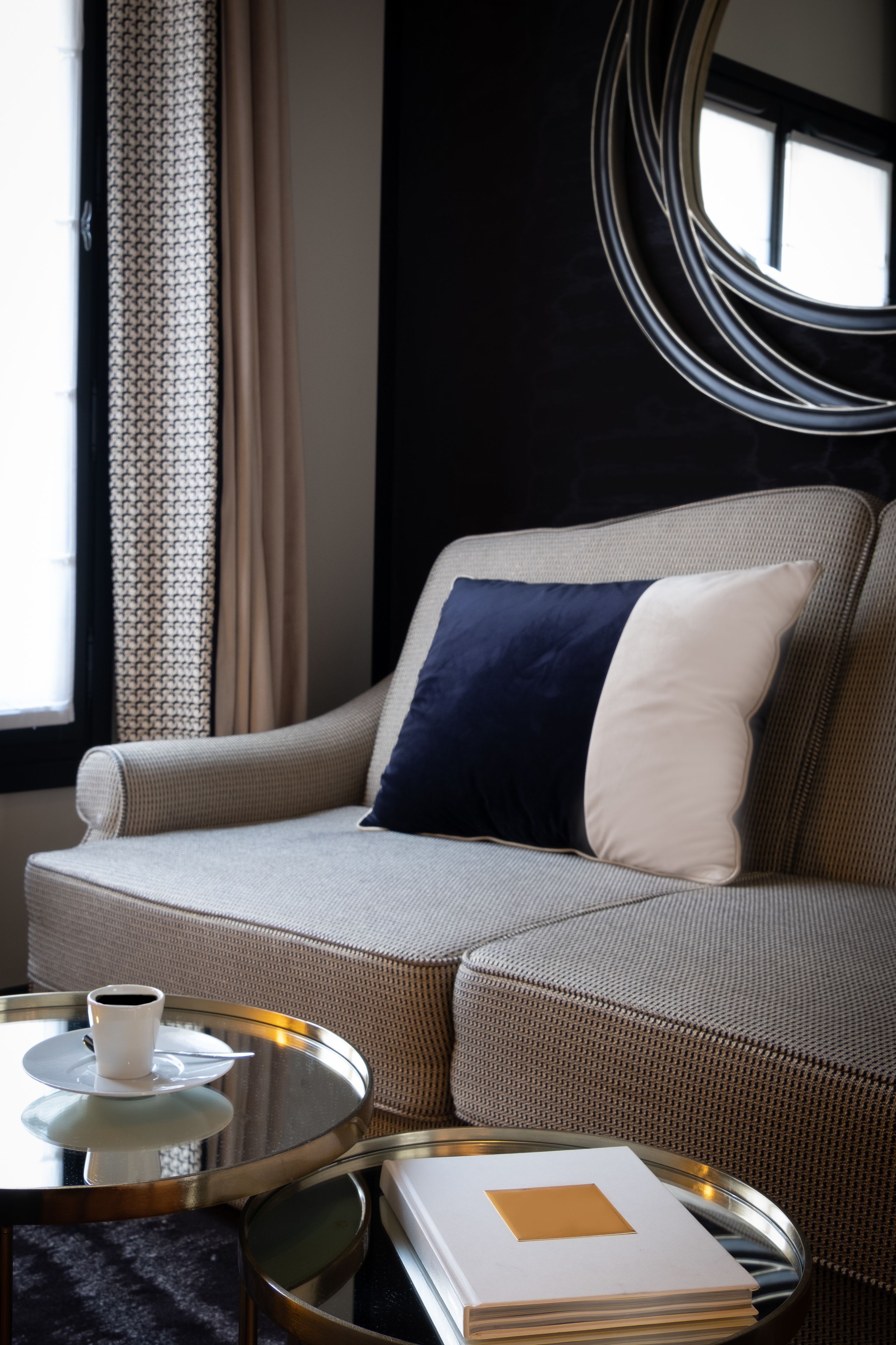 A cozy living area with a sofa, a coffee table, and a book.