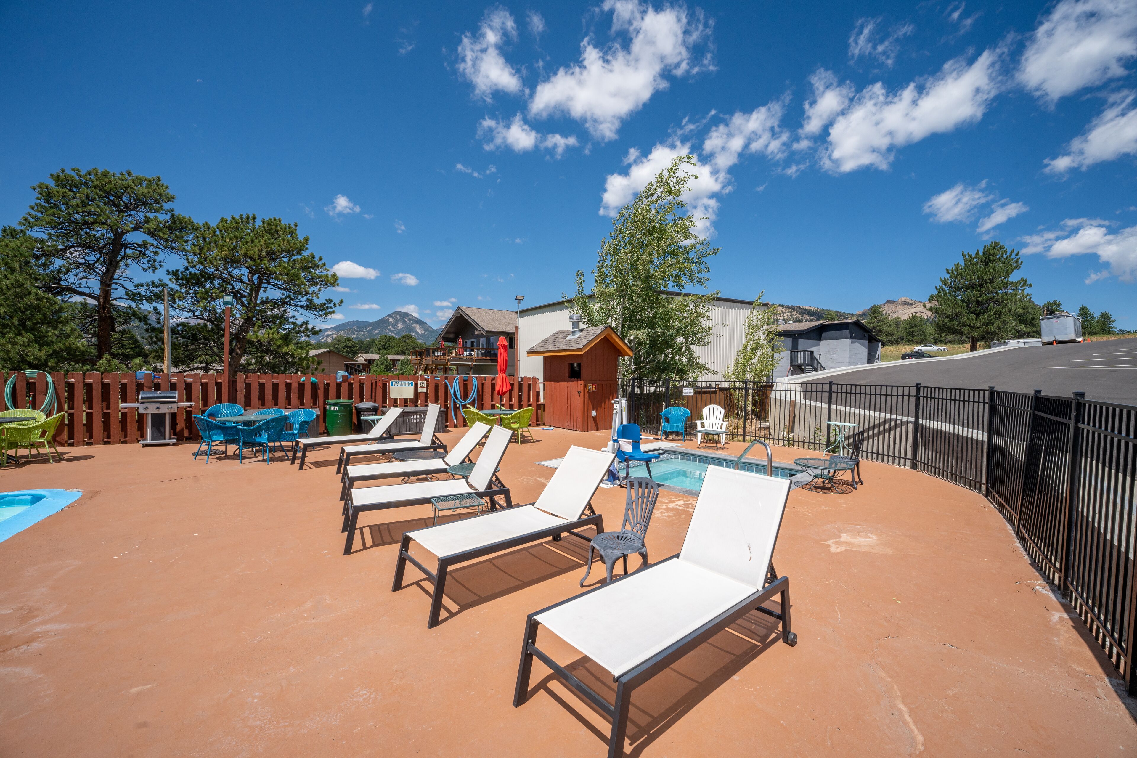 Seasonal outdoor pool, open 9:00 AM to 9:00 PM, pool umbrellas