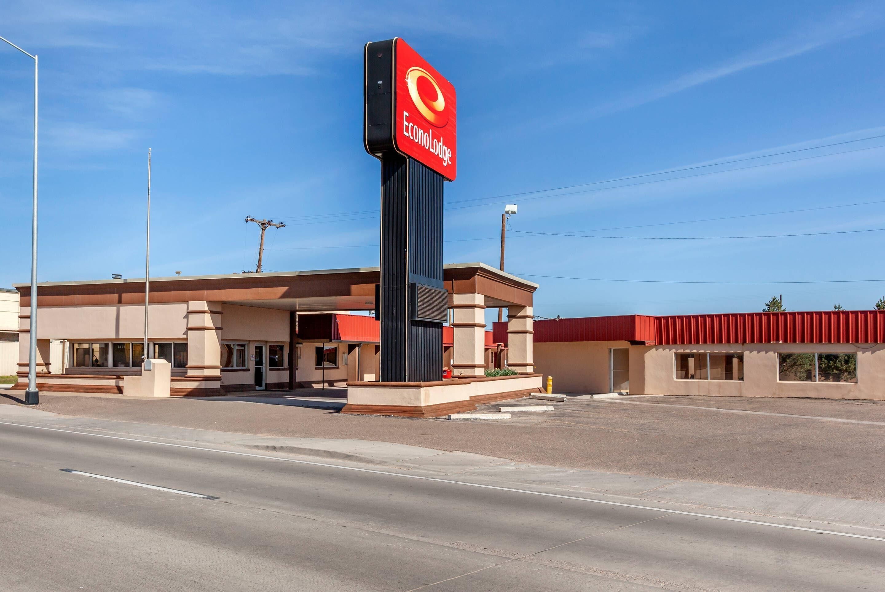 A building with a prominent red and white sign reading "Econo Lodge."