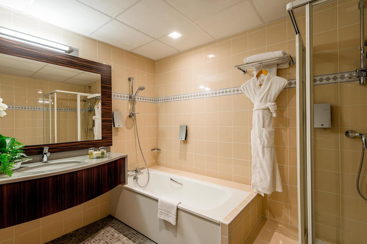 deep-soaking bathtub, rainfall showerhead, free toiletries, hair dryer