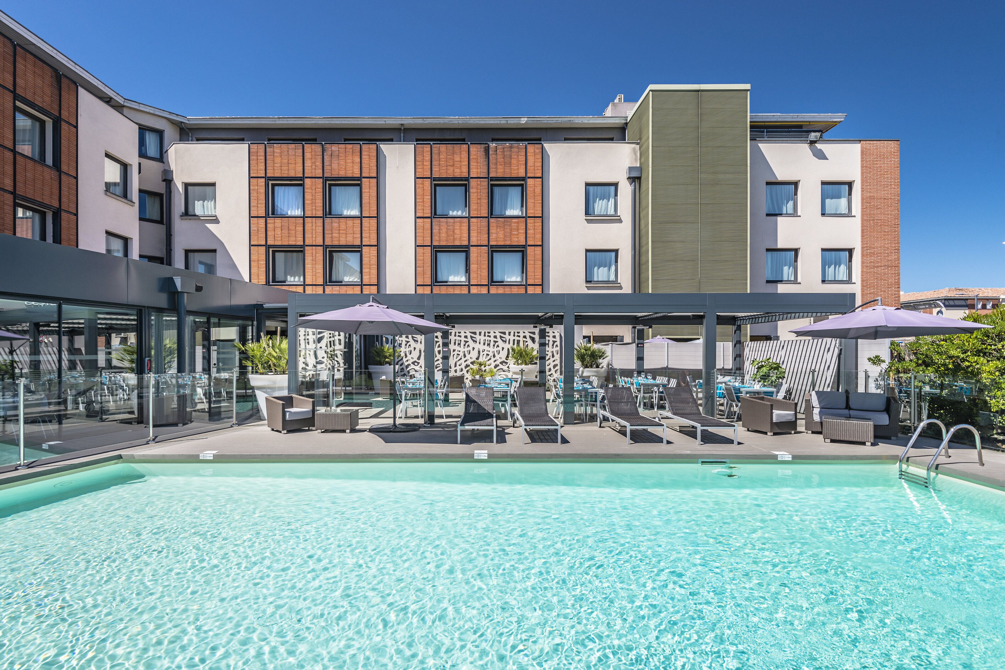 outdoor pool, pool umbrellas, pool loungers