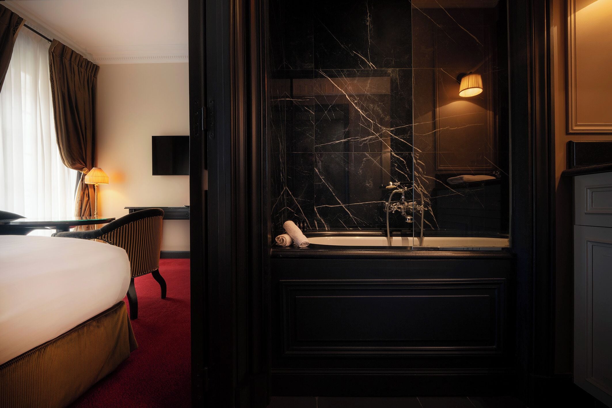 deluxe room, 1 king bed, bathtub | bathroom | designer toiletries, hair dryer, bathrobes, slippers