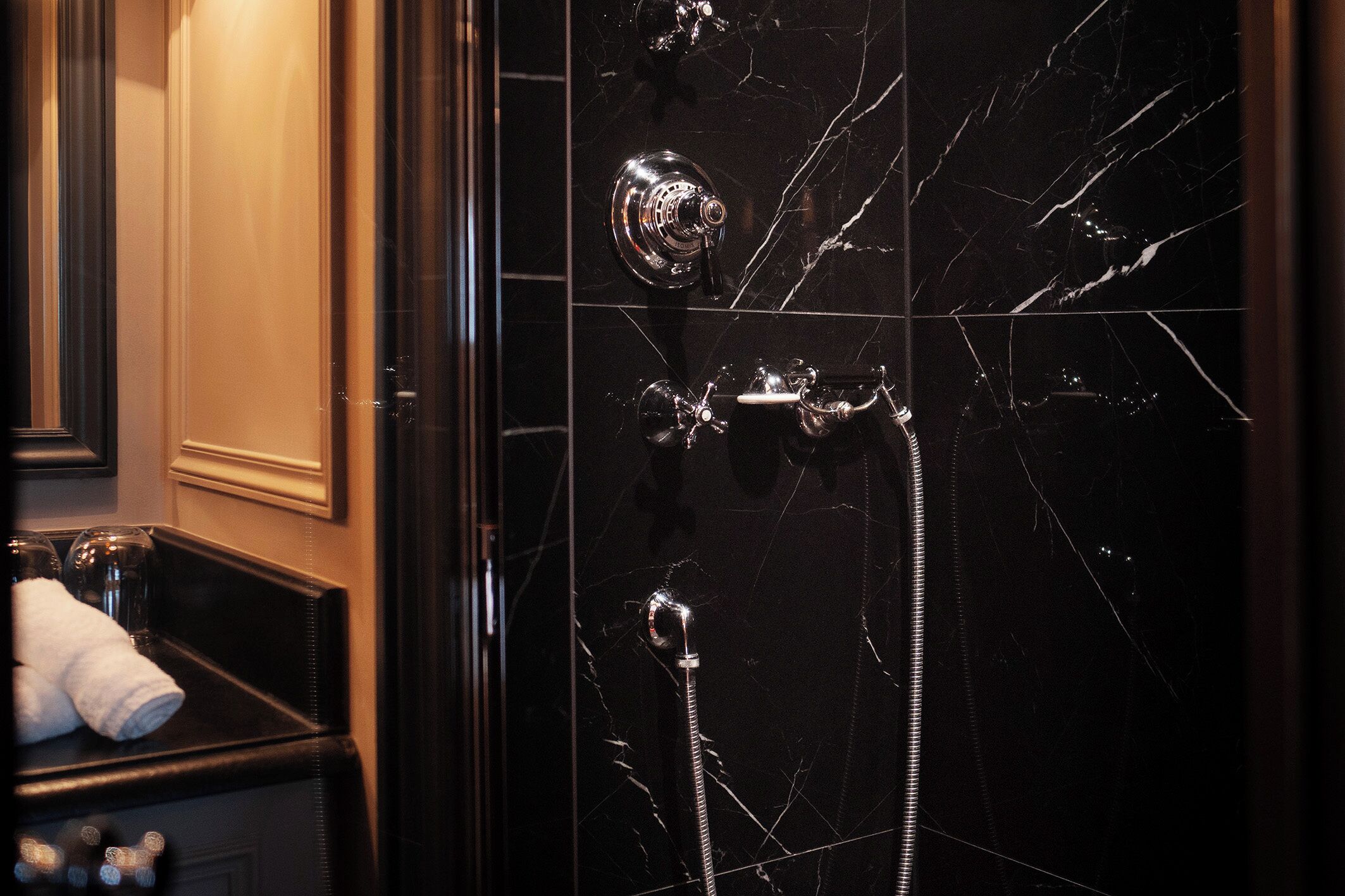 designer toiletries, hair dryer, bathrobes, slippers