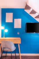 Premium bedding, desk, laptop workspace, soundproofing