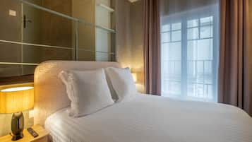 Premium bedding, desk, laptop workspace, soundproofing
