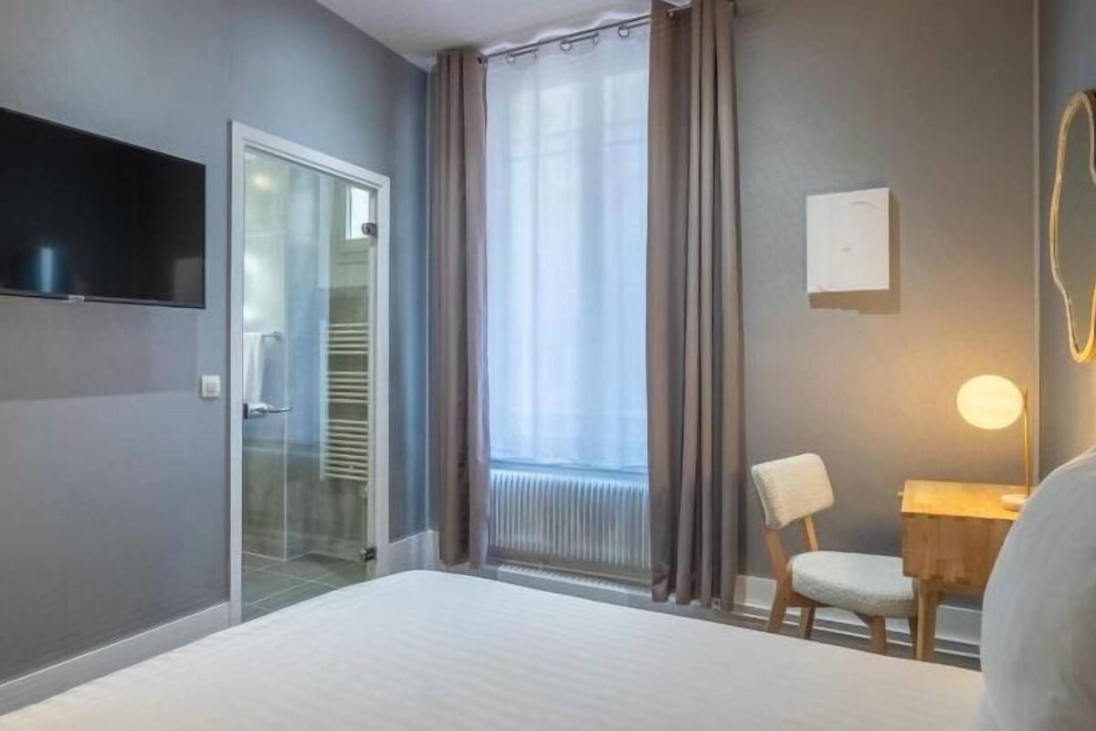 Premium bedding, desk, laptop workspace, soundproofing