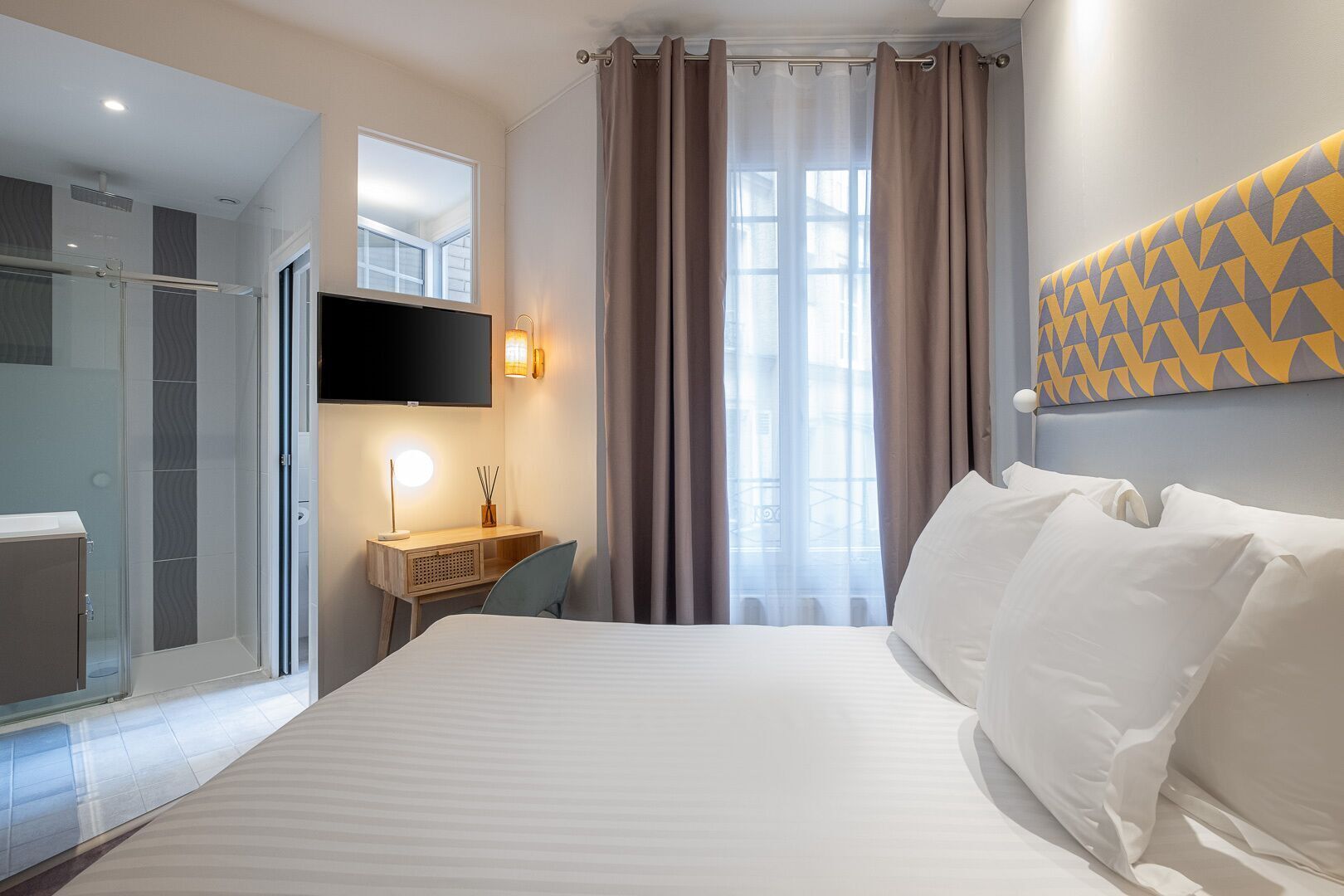 Premium bedding, desk, laptop workspace, soundproofing