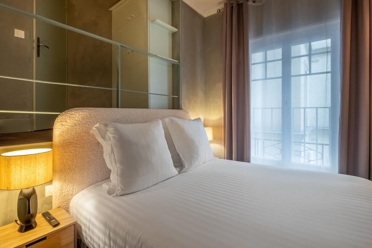 Premium bedding, desk, laptop workspace, soundproofing