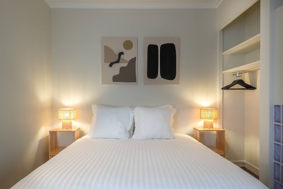 Premium bedding, desk, laptop workspace, soundproofing