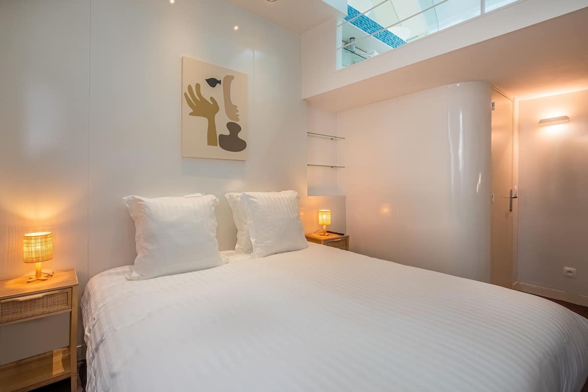 Premium bedding, desk, laptop workspace, soundproofing
