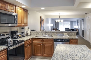 2 Bedroom Suite with 1 King and 2 Twin Beds | Private kitchen | Fridge, microwave, oven, stovetop at Hilton Vacation Club Polynesian Isles Kissimmee