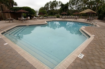 Outdoor pool, sun loungers at Hilton Vacation Club Polynesian Isles Kissimmee