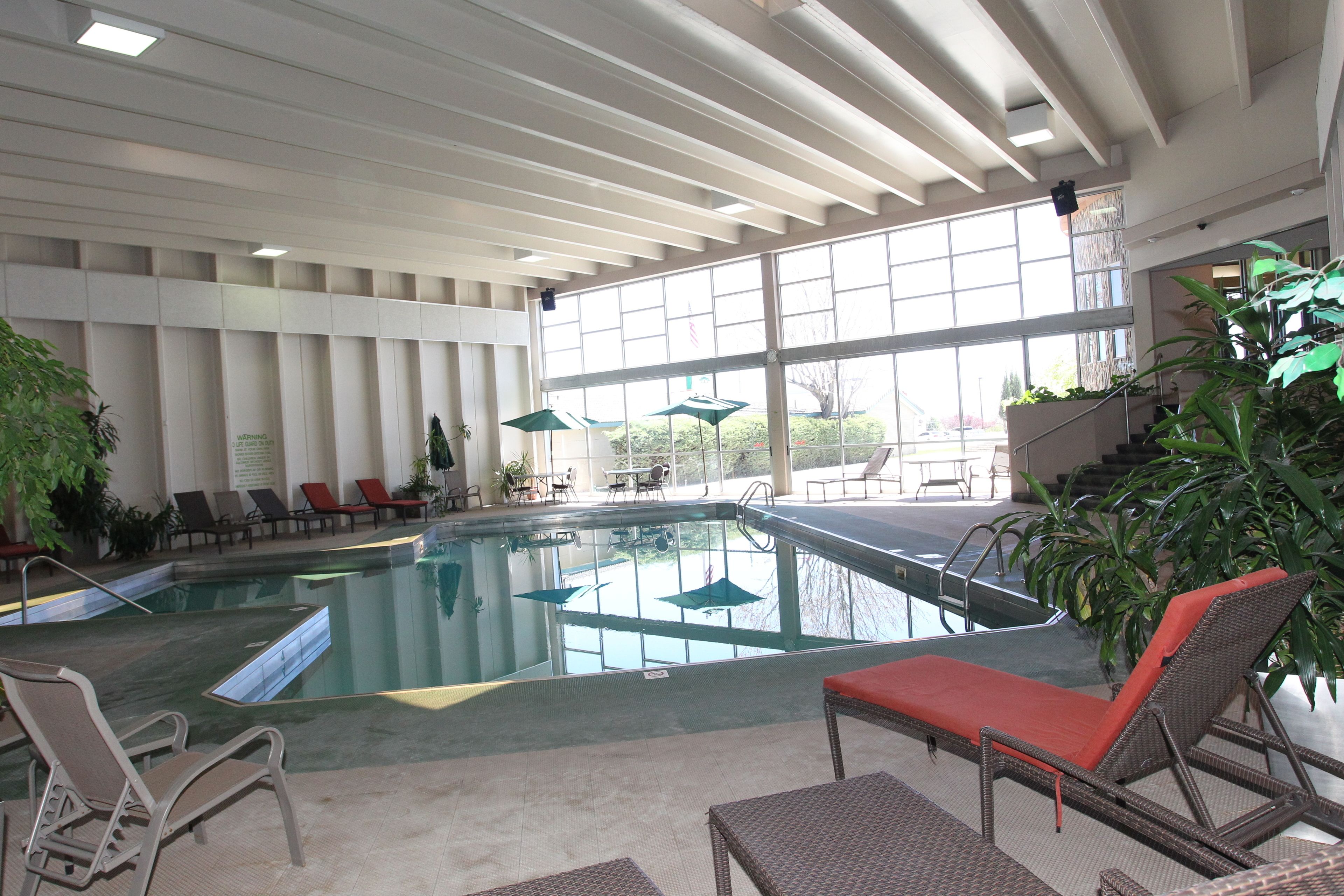 Indoor pool, pool umbrellas, sun loungers