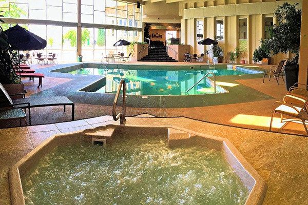 Indoor pool, pool umbrellas, sun loungers