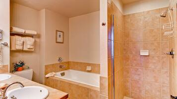 A bathroom with a sink, toilet, and bathtub.