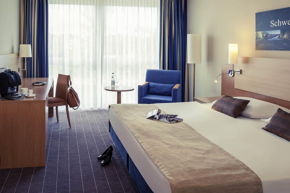 Hypo-allergenic bedding, desk, laptop workspace, blackout curtains