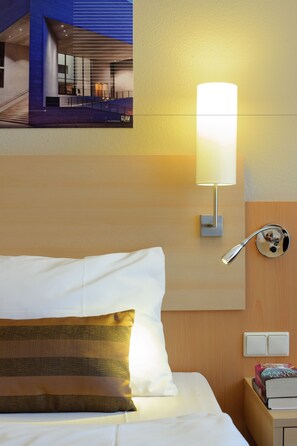 Hypo-allergenic bedding, desk, laptop workspace, blackout curtains
