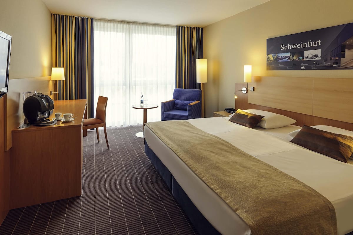 Hypo-allergenic bedding, desk, laptop workspace, blackout curtains