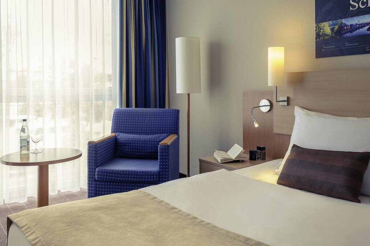 hypo-allergenic bedding, desk, laptop workspace, blackout curtains