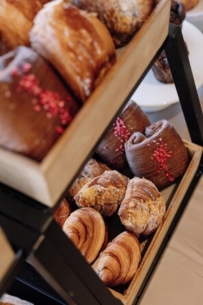 A display of assorted pastries in a tray.