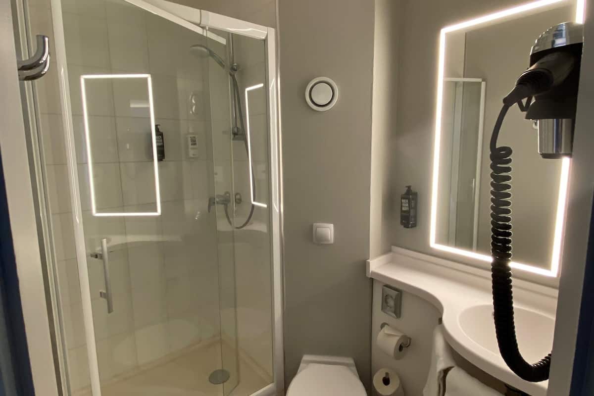 Shower, eco-friendly toiletries, hair dryer, towels