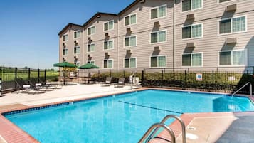 Seasonal outdoor pool, open 10:00 AM to 9:00 PM, pool umbrellas