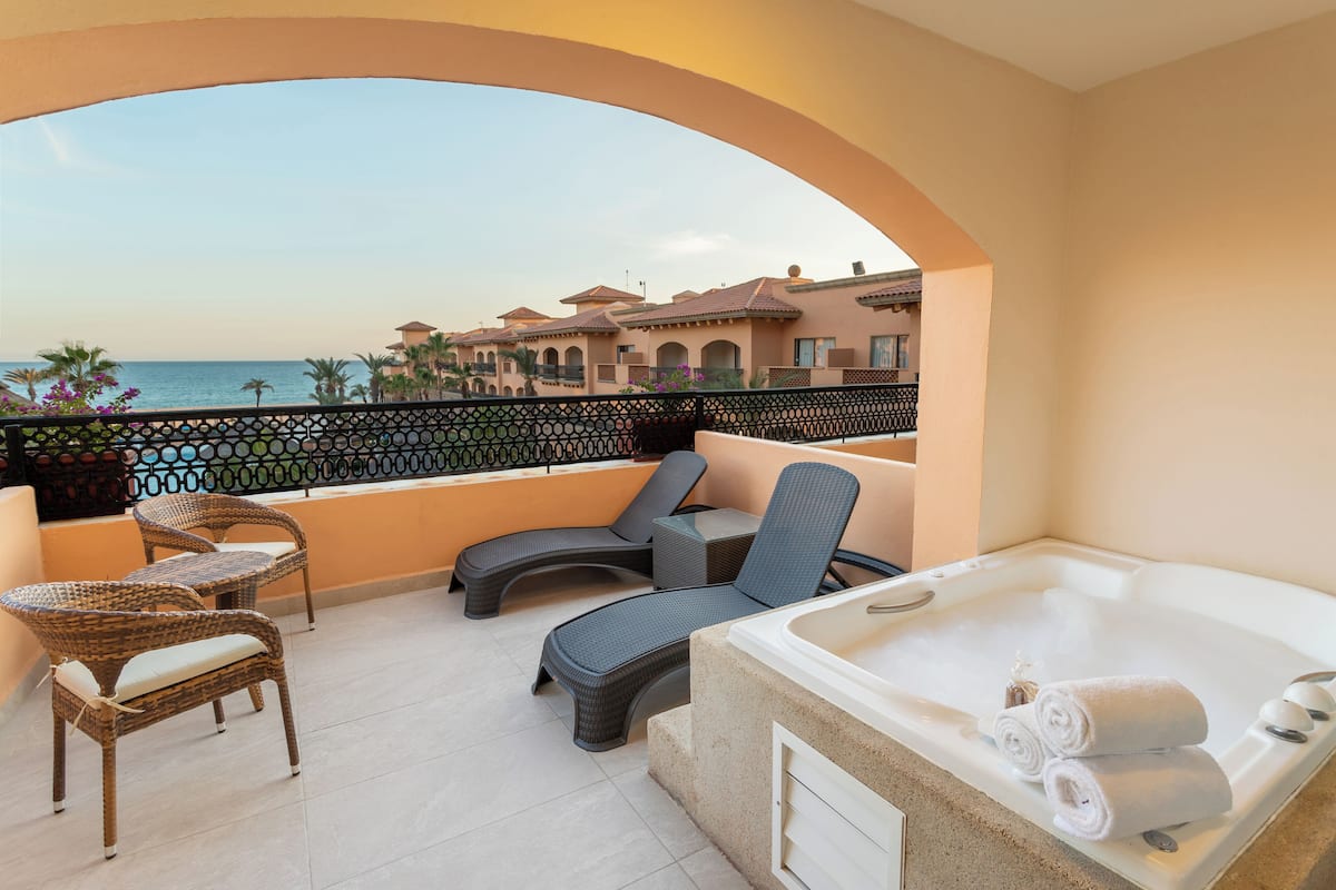 Deluxe Room Balcony, 1 King Bed, Jetted Tub, Ocean View | Free minibar, in-room safe, desk, blackout drapes