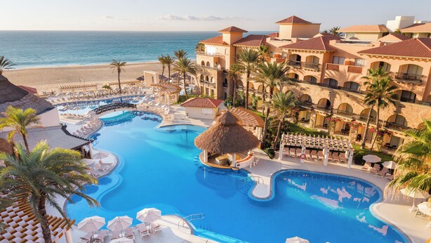 A resort with multiple swimming pools, a beach, and a large building with balconies. - Royal Solaris Los Cabos & Spa - All Inclusive (San José del Cabo)