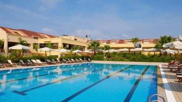 Outdoor pool, open 9:00 AM to 7:00 PM, pool umbrellas, pool loungers
