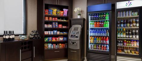 A self-service beverage station with a variety of drinks and snacks.