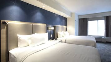 Down duvets, pillow-top beds, in-room safe, desk