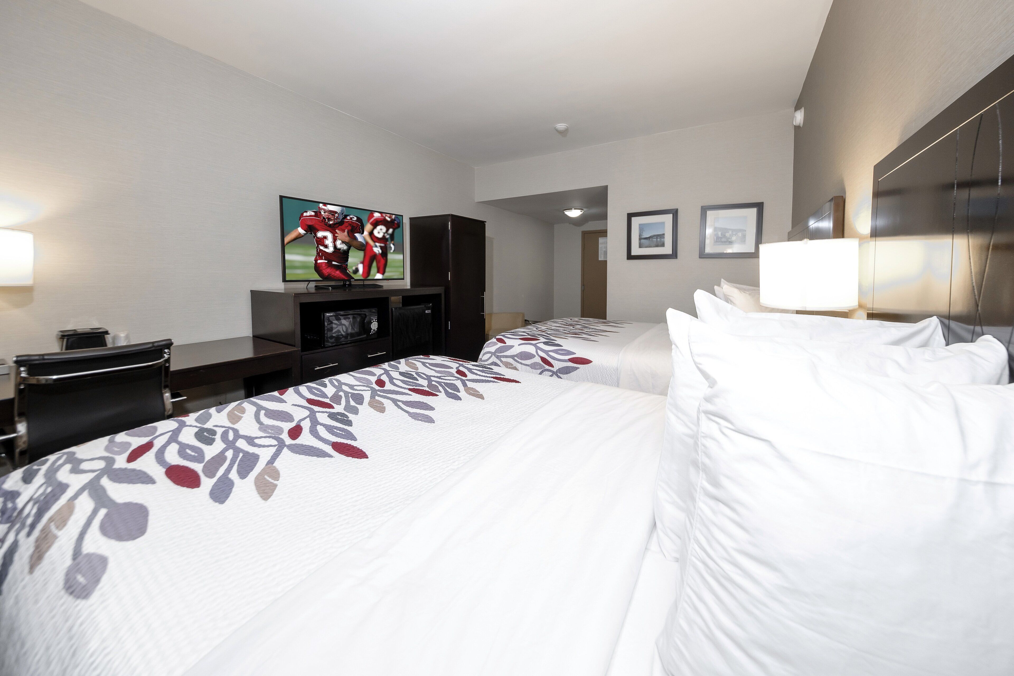 deluxe room, 2 queen beds, non smoking, lake view | desk, iron/ironing board, free cots/infant beds, rollaway beds