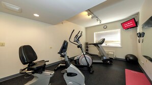 A gym with stationary bikes, a treadmill, and exercise balls. - Red Roof Inn & Suites Newburgh – Stewart Airport/ West Point (New Windsor)