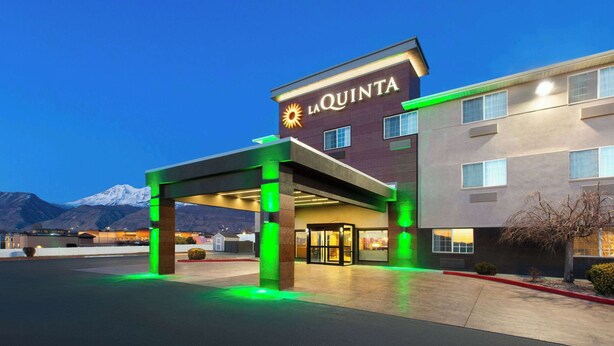 A hotel entrance with a sign reading "La Quinta". - La Quinta Inn & Suites by Wyndham North Orem (Orem)