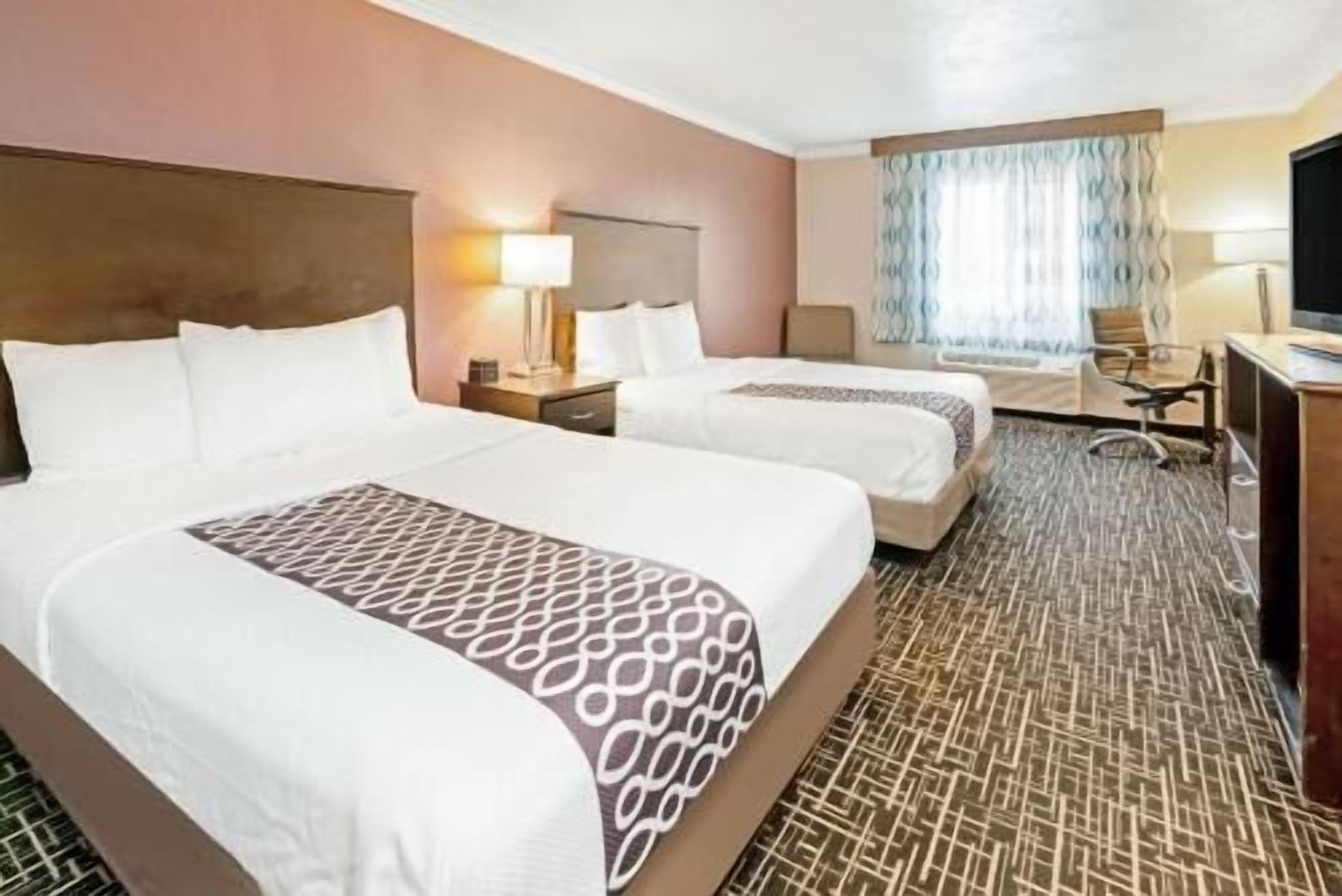 Premium bedding, pillowtop beds, desk, blackout drapes