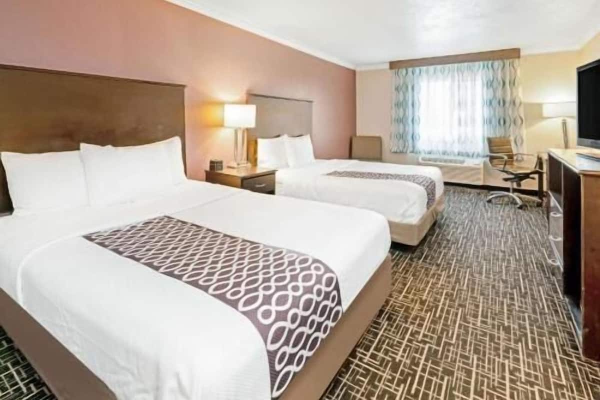 Premium bedding, pillowtop beds, desk, blackout drapes