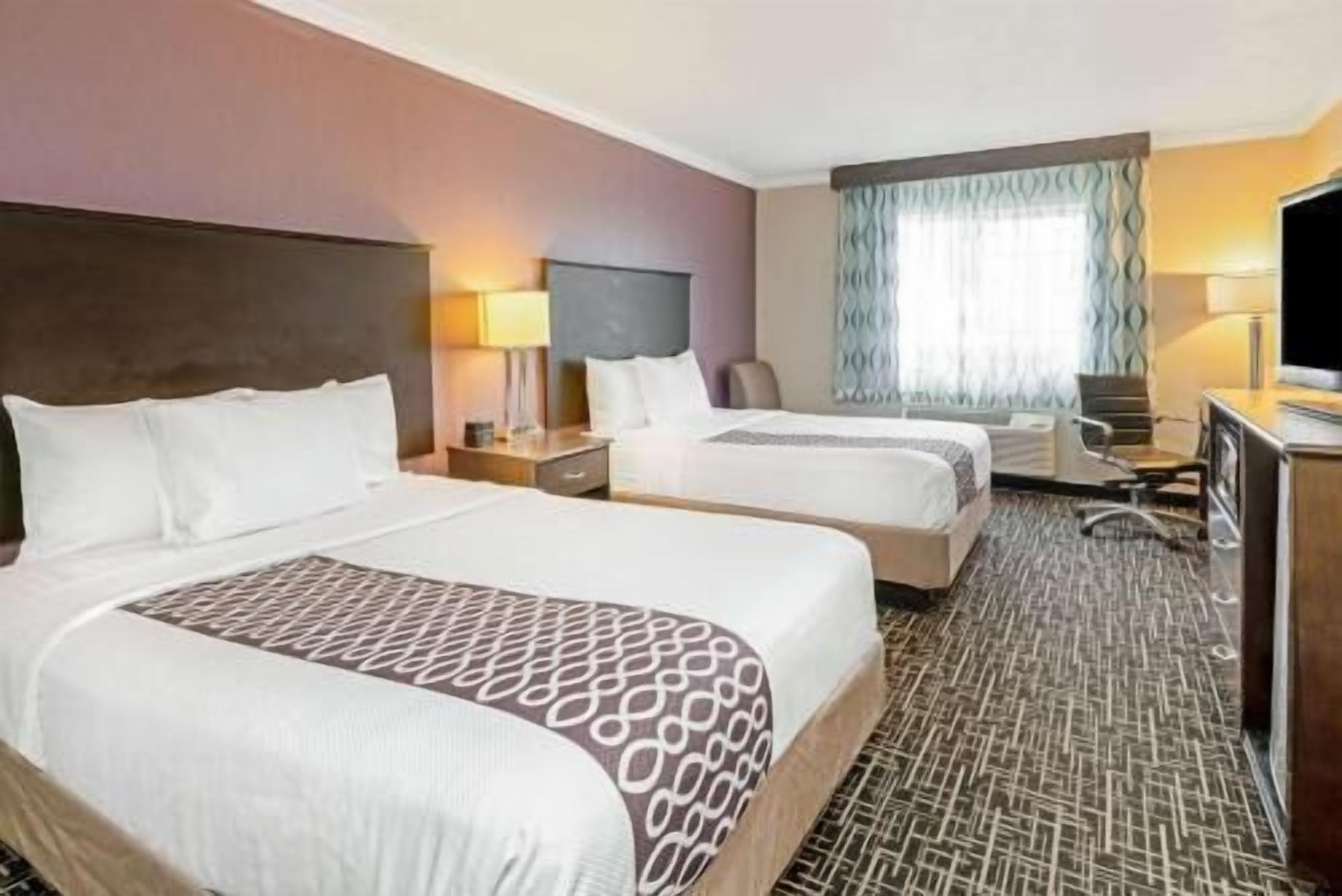 Premium bedding, pillowtop beds, desk, blackout drapes