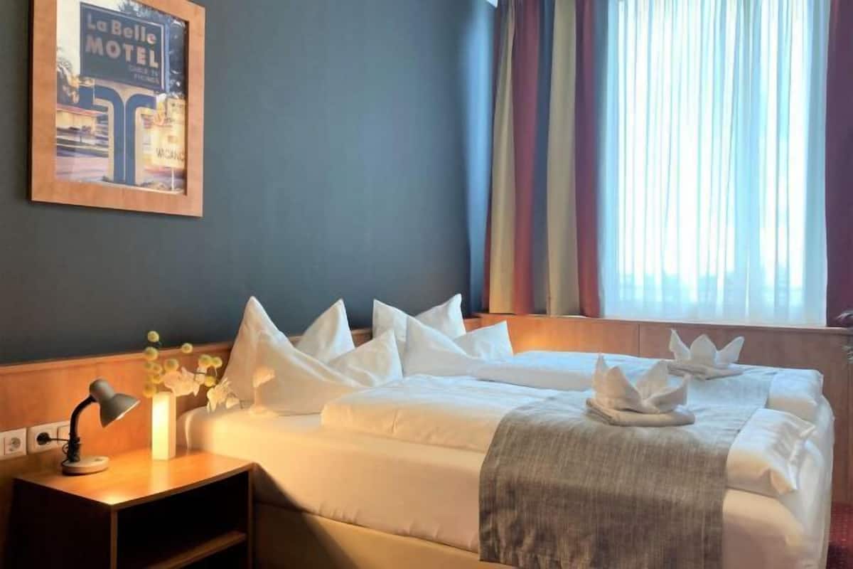 Hypo-allergenic bedding, desk, blackout drapes, soundproofing