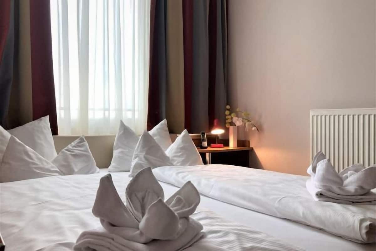 Hypo-allergenic bedding, desk, blackout drapes, soundproofing