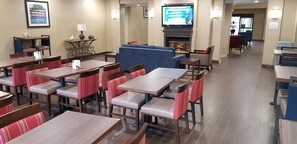Relax in the hotel lobby, where you can dine at a table or unwind on a sofa by the fireplace.