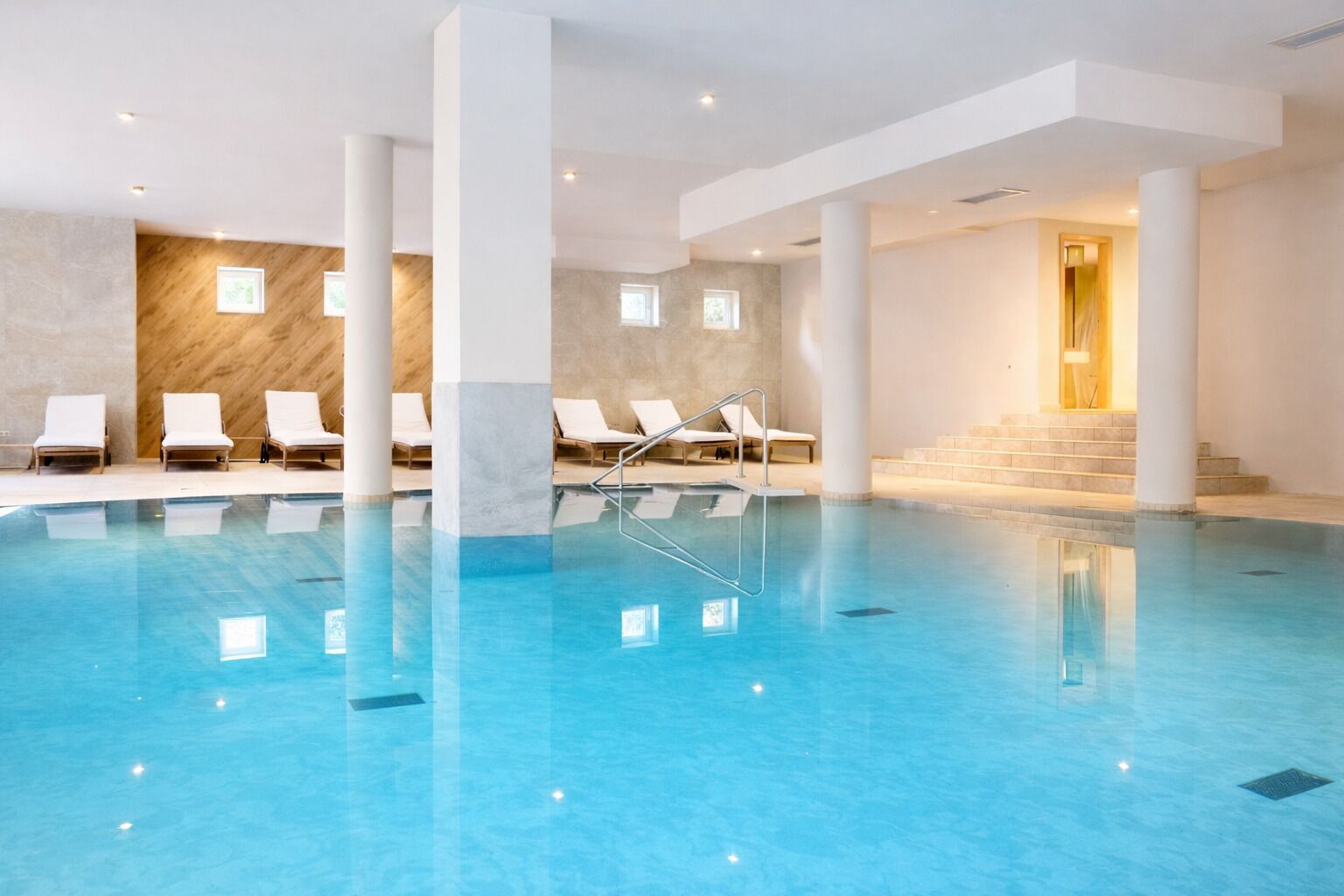 Indoor pool, seasonal outdoor pool, pool umbrellas, sun loungers