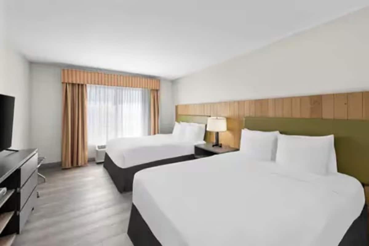 Premium bedding, pillowtop beds, desk, blackout drapes
