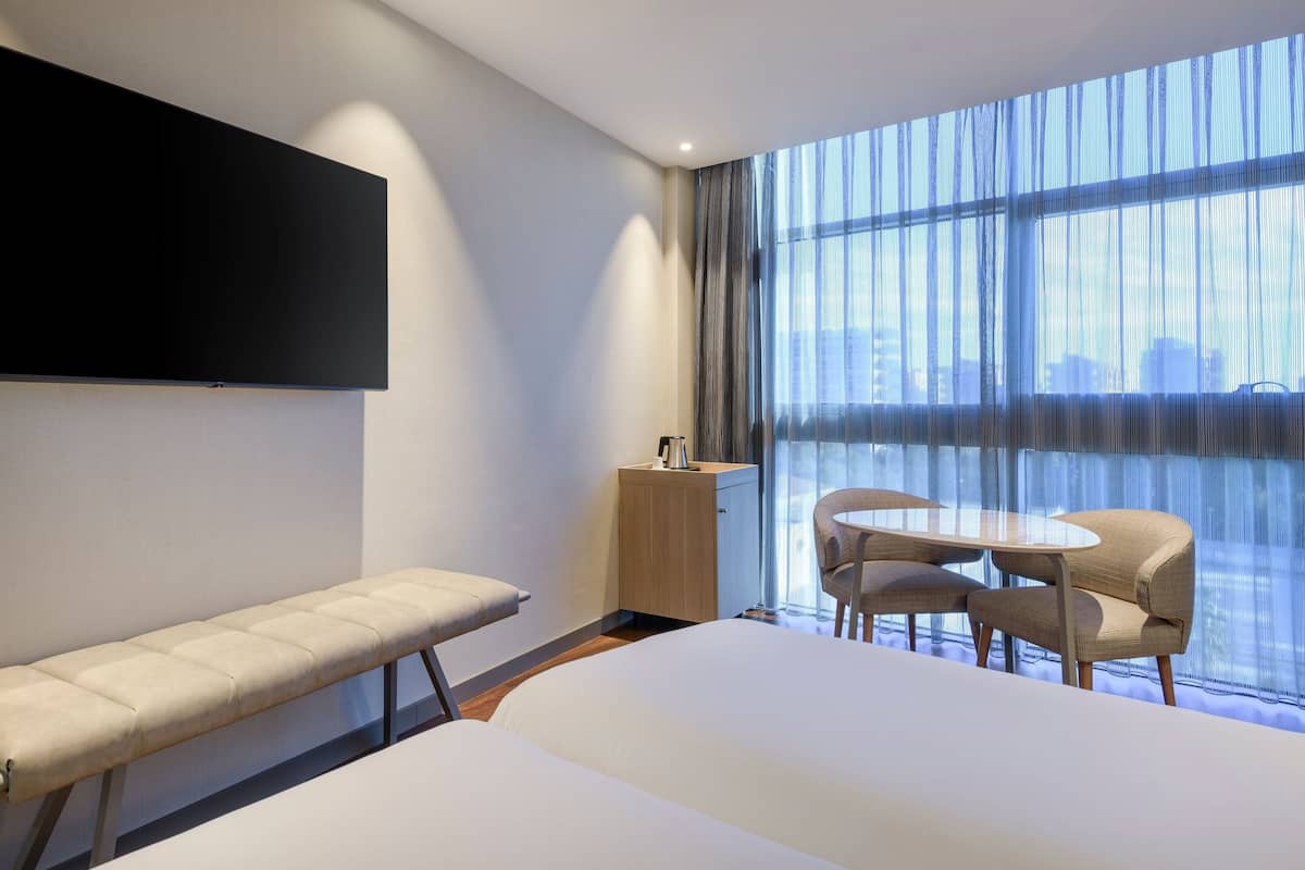 room, 2 single beds | minibar, in-room safe, desk, blackout curtains