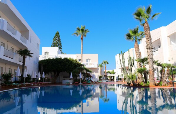 Indoor pool, 3 outdoor pools, open 9 AM to 8 PM, pool umbrellas