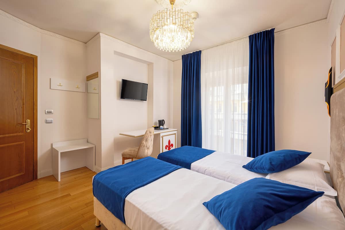 Hypo-allergenic bedding, pillow-top beds, in-room safe, desk