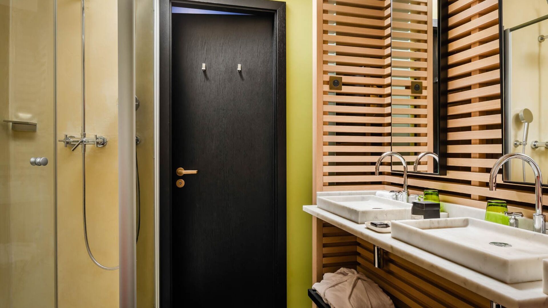 deluxe double room | bathroom | rainfall showerhead, designer toiletries, hair dryer, bathrobes