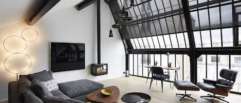 Signature Apartment | Living room | 102-cm flat-screen TV with satellite channels, TV, iPod dock