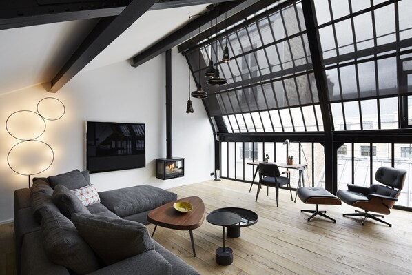 Signature Apartment | Living room | 102-cm flat-screen TV with satellite channels, TV, iPod dock - Hotel Du Ministere (Paris)