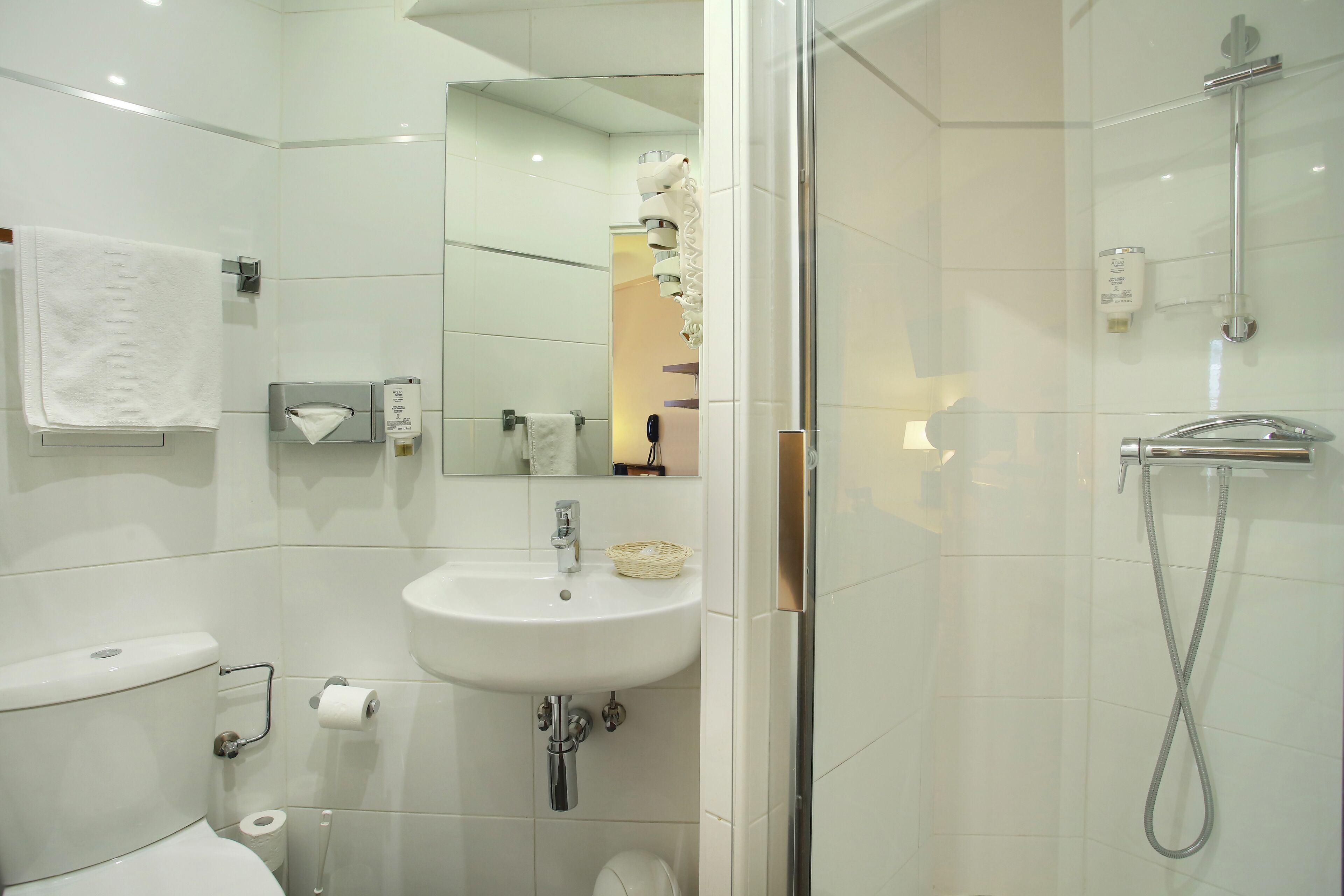 shower, hair dryer, slippers, towels